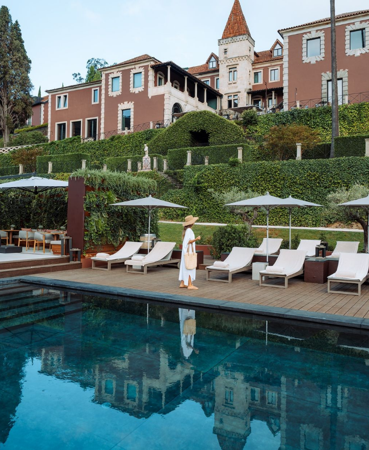 Poolside view of Six Senses Douro Valley in Portugal, combining wine-inspired wellness with breathtaking vineyard views.