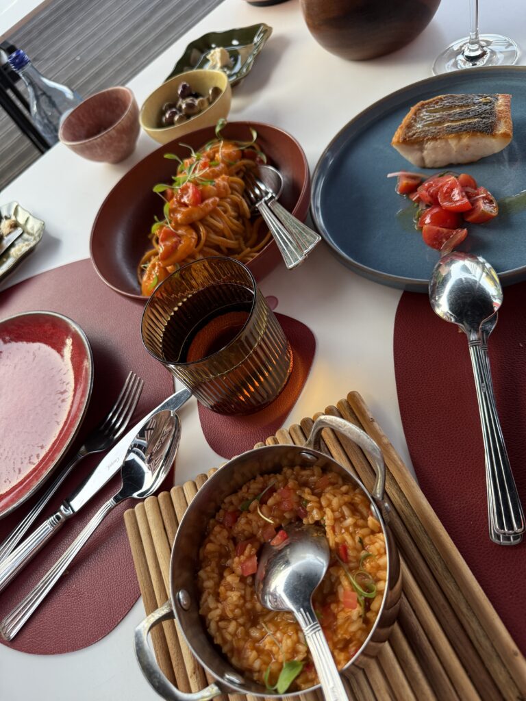 Enjoying Portuguese cuisine during our Portugal girls trip itinerary, from fresh seafood to Michelin-starred dining.
