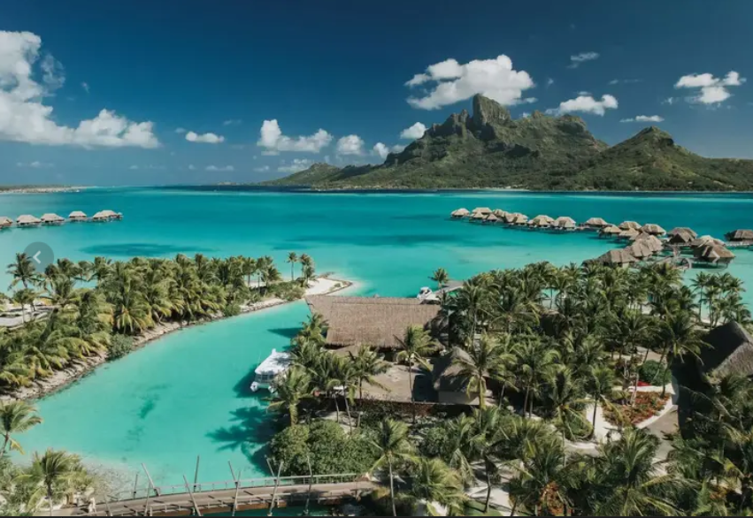 Overwater bungalows and turquoise lagoon in Bora Bora—luxury island-hopping in French Polynesia