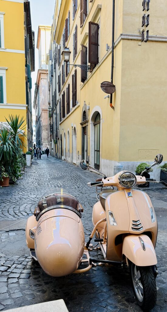 exploring Rome by vintage Vespa sidecar with a private guide through historic streets